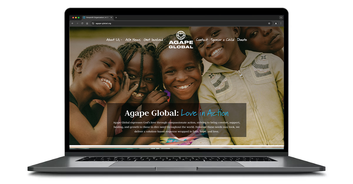 Agape-Global.org homepage on a laptop